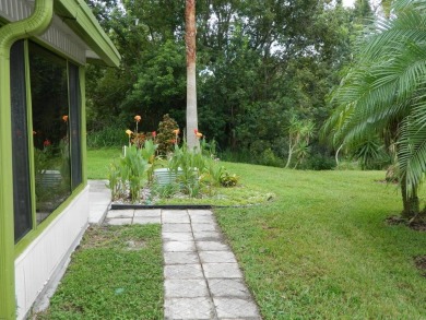 Lovely oasis in backyard, this 1,467 sq ft home on a perimeter on Grasslands Golf and Country Club in Florida - for sale on GolfHomes.com, golf home, golf lot