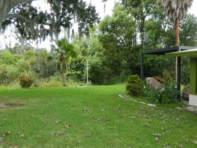 Lovely oasis in backyard, this 1,467 sq ft home on a perimeter on Grasslands Golf and Country Club in Florida - for sale on GolfHomes.com, golf home, golf lot