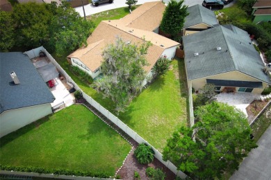 Under contract-accepting backup offers. Absolutely impeccable on Tuscawilla Country Club in Florida - for sale on GolfHomes.com, golf home, golf lot