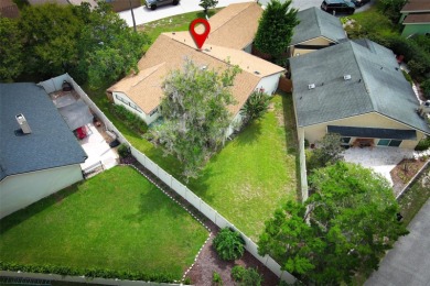 Under contract-accepting backup offers. Absolutely impeccable on Tuscawilla Country Club in Florida - for sale on GolfHomes.com, golf home, golf lot