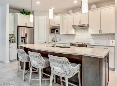 This upgraded 2023 Pulte Summerwood floor plan features an on River Hall Country Club in Florida - for sale on GolfHomes.com, golf home, golf lot