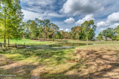 Nestled on a sprawling 4.35 acres the prestigious Lake Caroline on Lake Caroline Golf Club in Mississippi - for sale on GolfHomes.com, golf home, golf lot