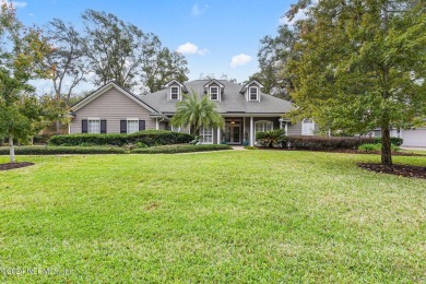 This elegant southern-style pool home in  prestigious Queens on Queens Harbour Yacht and Country Club in Florida - for sale on GolfHomes.com, golf home, golf lot