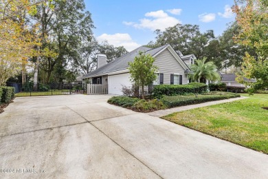 This elegant southern-style pool home in  prestigious Queens on Queens Harbour Yacht and Country Club in Florida - for sale on GolfHomes.com, golf home, golf lot