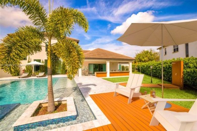 Stunning Parkland Contemporary-style estate with amazing lake on Heron Bay Golf Club in Florida - for sale on GolfHomes.com, golf home, golf lot