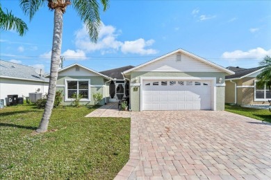 Morning coffee or evening cocktails on the enclosed lanai on Spanish Lakes Fairways in Florida - for sale on GolfHomes.com, golf home, golf lot