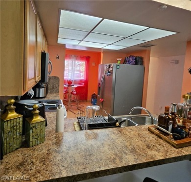 Embrace resort-style living in this vibrant 2-bedroom, 2-bath on Lehigh Resort Club in Florida - for sale on GolfHomes.com, golf home, golf lot