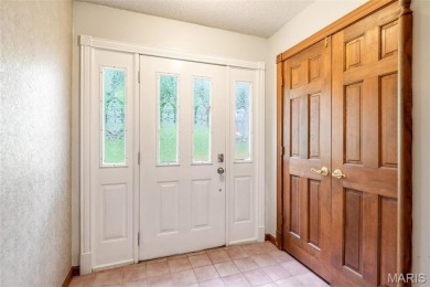 Welcome to your dream Lodge-like home nestled on a sprawling on Raintree Country Club in Missouri - for sale on GolfHomes.com, golf home, golf lot