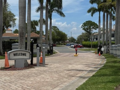Enjoy all the benefits of Florida living, without the hassle of on Feather Sound Country Club in Florida - for sale on GolfHomes.com, golf home, golf lot