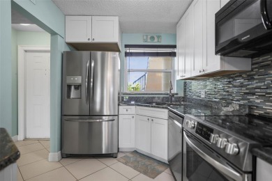 Enjoy all the benefits of Florida living, without the hassle of on Feather Sound Country Club in Florida - for sale on GolfHomes.com, golf home, golf lot