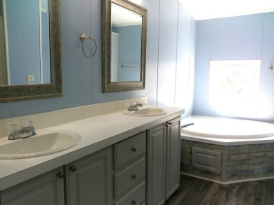 If you're searching for a beautiful, move-in ready home with on Hamptons Golf Club in Florida - for sale on GolfHomes.com, golf home, golf lot