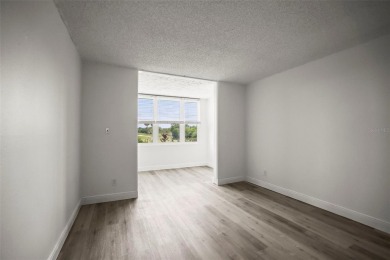 Enjoy all the benefits of Florida living, without the hassle of on Feather Sound Country Club in Florida - for sale on GolfHomes.com, golf home, golf lot