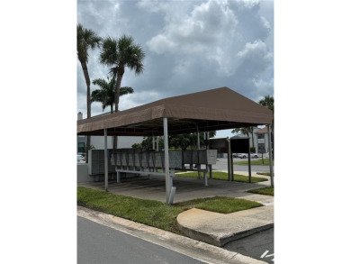 Enjoy all the benefits of Florida living, without the hassle of on Feather Sound Country Club in Florida - for sale on GolfHomes.com, golf home, golf lot