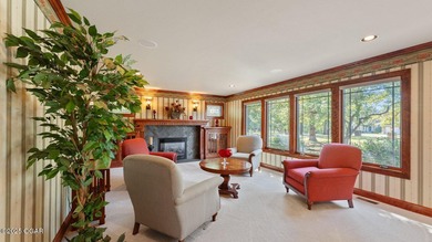 Inspired by the timeless architectural influence of Frank Lloyd on Nevada Country Club in Missouri - for sale on GolfHomes.com, golf home, golf lot