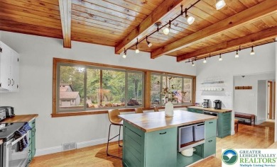 Step into this 3-bedroom, 2-bath Lake Harmony home showcasing on Split Rock Resort and Country Club in Pennsylvania - for sale on GolfHomes.com, golf home, golf lot