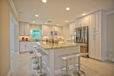 Stunning golf course views, 3 bedroom, 3 full bath home. Primary on Atlantis Golf Club in Florida - for sale on GolfHomes.com, golf home, golf lot