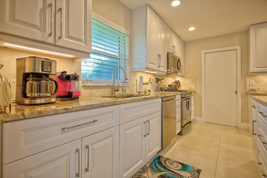 Stunning golf course views, 3 bedroom, 3 full bath home. Primary on Atlantis Golf Club in Florida - for sale on GolfHomes.com, golf home, golf lot