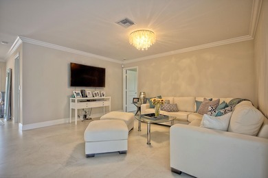 Stunning golf course views, 3 bedroom, 3 full bath home. Primary on Atlantis Golf Club in Florida - for sale on GolfHomes.com, golf home, golf lot