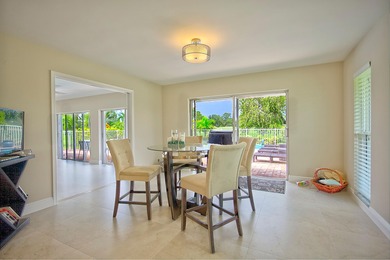 Stunning golf course views, 3 bedroom, 3 full bath home. Primary on Atlantis Golf Club in Florida - for sale on GolfHomes.com, golf home, golf lot