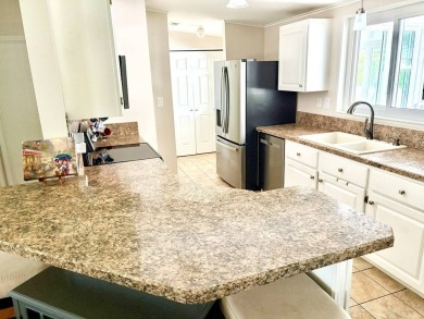 Step into luxury with this stunning 2-bedroom, 2-bathroom Pebble on Crane Lakes Golf and Country Club in Florida - for sale on GolfHomes.com, golf home, golf lot