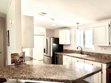 Step into luxury with this stunning 2-bedroom, 2-bathroom Pebble on Crane Lakes Golf and Country Club in Florida - for sale on GolfHomes.com, golf home, golf lot
