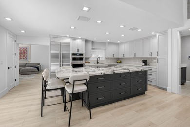 FULLY RENOVATED one-story, 3 bedroom + large den/office home in on St. Andrews Country Club of Boca Raton in Florida - for sale on GolfHomes.com, golf home, golf lot