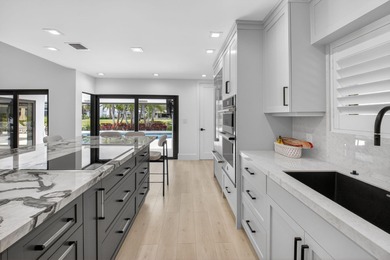 FULLY RENOVATED one-story, 3 bedroom + large den/office home in on St. Andrews Country Club of Boca Raton in Florida - for sale on GolfHomes.com, golf home, golf lot