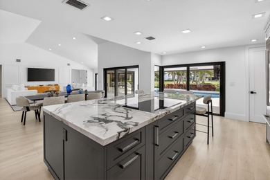 FULLY RENOVATED one-story, 3 bedroom + large den/office home in on St. Andrews Country Club of Boca Raton in Florida - for sale on GolfHomes.com, golf home, golf lot