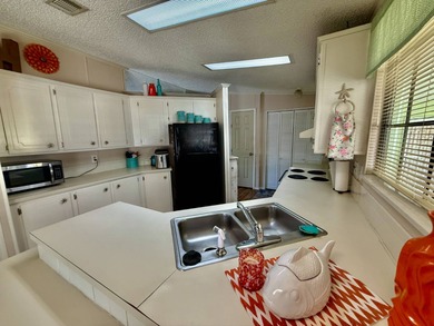 Home is located in Water Oak Country Club Estates in Lady Lake on Water Oak Country Club Estates in Florida - for sale on GolfHomes.com, golf home, golf lot