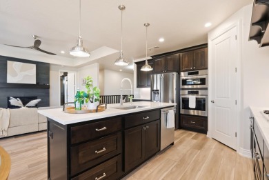 Enjoy life with virtually no power bill in this thoughtfully on Green Spring Country Club in Utah - for sale on GolfHomes.com, golf home, golf lot