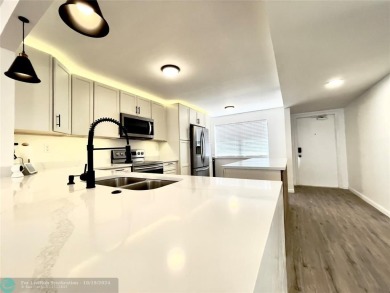 Beautifully Updated Corner Unit. Open Concept Kitchen styled in on Sunrise Lakes Phase IV Golf Course in Florida - for sale on GolfHomes.com, golf home, golf lot