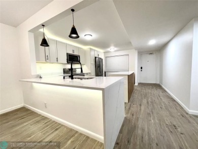 Beautifully Updated Corner Unit. Open Concept Kitchen styled in on Sunrise Lakes Phase IV Golf Course in Florida - for sale on GolfHomes.com, golf home, golf lot