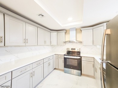 Beautifully renovated 2-bedroom, 1.5-bath ranch with carport on Rossmoor Golf Club in New Jersey - for sale on GolfHomes.com, golf home, golf lot