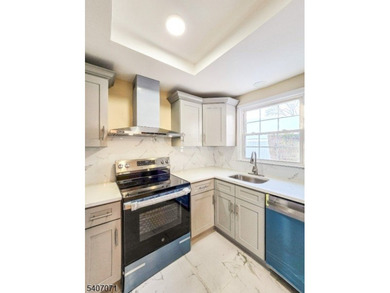 Beautifully renovated 2-bedroom, 1.5-bath ranch with carport on Rossmoor Golf Club in New Jersey - for sale on GolfHomes.com, golf home, golf lot