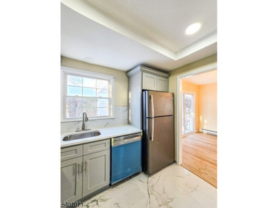 Beautifully renovated 2-bedroom, 1.5-bath ranch with carport on Rossmoor Golf Club in New Jersey - for sale on GolfHomes.com, golf home, golf lot