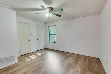 New flooring in living room, kitchen 2 bedrooms and 2 bathrooms on Chester W. Ditto Golf Course in Texas - for sale on GolfHomes.com, golf home, golf lot