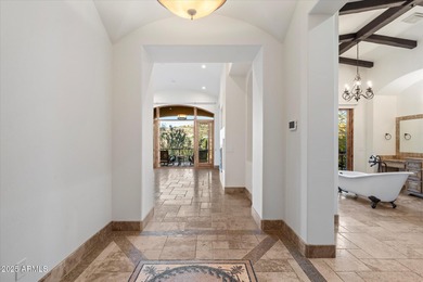 Private yet designed for grand-scale entertaining, this timeless on Eagle Mountain Golf Club in Arizona - for sale on GolfHomes.com, golf home, golf lot