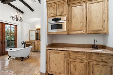 Private yet designed for grand-scale entertaining, this timeless on Eagle Mountain Golf Club in Arizona - for sale on GolfHomes.com, golf home, golf lot