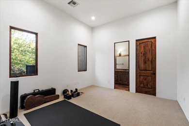 Private yet designed for grand-scale entertaining, this timeless on Eagle Mountain Golf Club in Arizona - for sale on GolfHomes.com, golf home, golf lot