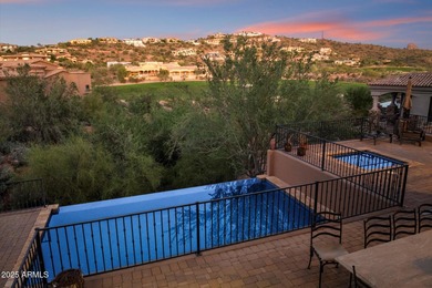 Private yet designed for grand-scale entertaining, this timeless on Eagle Mountain Golf Club in Arizona - for sale on GolfHomes.com, golf home, golf lot