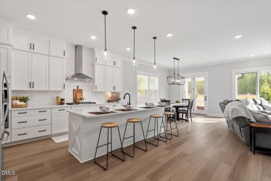 This beautifully designed and meticulously maintained on Hasentree Club in North Carolina - for sale on GolfHomes.com, golf home, golf lot