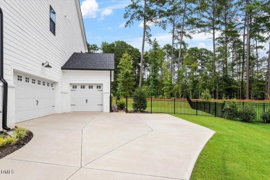 This beautifully designed and meticulously maintained on Hasentree Club in North Carolina - for sale on GolfHomes.com, golf home, golf lot