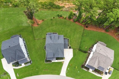 This beautifully designed and meticulously maintained on Hasentree Club in North Carolina - for sale on GolfHomes.com, golf home, golf lot