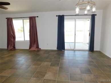 Discover this stunning 3-bedroom, 2-bath home located on a on Desert Lakes Golf Course in Arizona - for sale on GolfHomes.com, golf home, golf lot