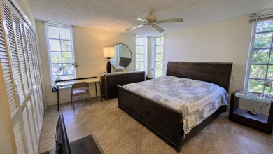 Enjoy serene lake views from this bright and spacious 3-bedroom on Palm-Aire Country Club and Resort - Palms in Florida - for sale on GolfHomes.com, golf home, golf lot