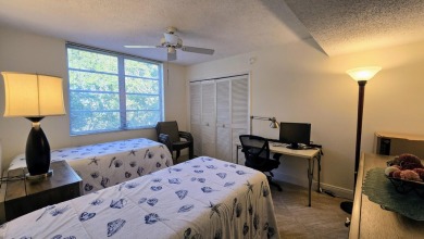 Enjoy serene lake views from this bright and spacious 3-bedroom on Palm-Aire Country Club and Resort - Palms in Florida - for sale on GolfHomes.com, golf home, golf lot