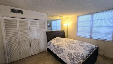 Enjoy serene lake views from this bright and spacious 3-bedroom on Palm-Aire Country Club and Resort - Palms in Florida - for sale on GolfHomes.com, golf home, golf lot
