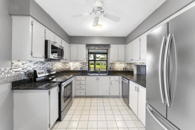 Welcome to your turnkey villa in the prestigious man-gated on Eastpointe Country Club in Florida - for sale on GolfHomes.com, golf home, golf lot