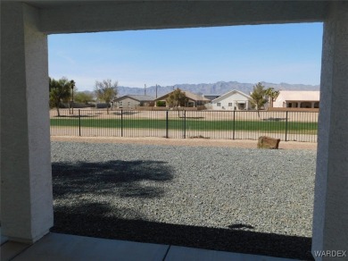 Discover this stunning 3-bedroom, 2-bath home located on a on Desert Lakes Golf Course in Arizona - for sale on GolfHomes.com, golf home, golf lot