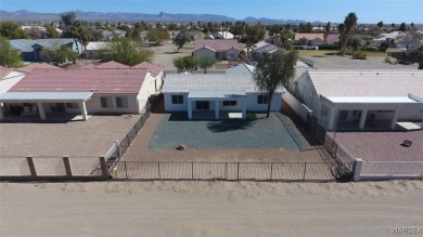 Discover this stunning 3-bedroom, 2-bath home located on a on Desert Lakes Golf Course in Arizona - for sale on GolfHomes.com, golf home, golf lot